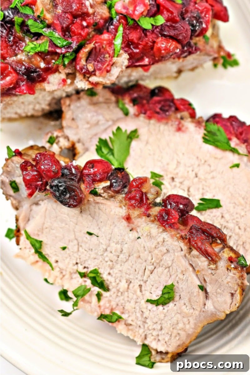 Slow Cooker Keto Cranberry Pork Loin Roast, ready to be served for a low-carb holiday meal.