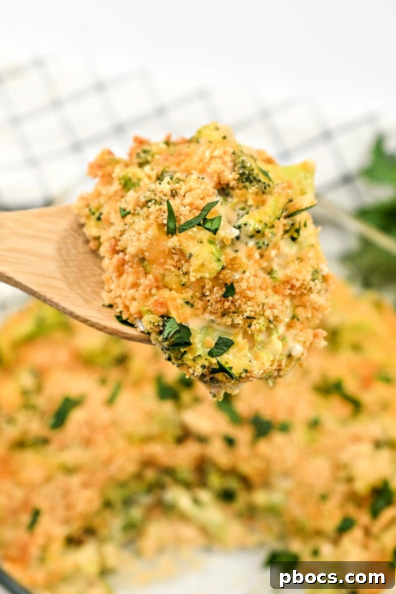 Broccoli florets coated in a rich, golden keto cheese sauce