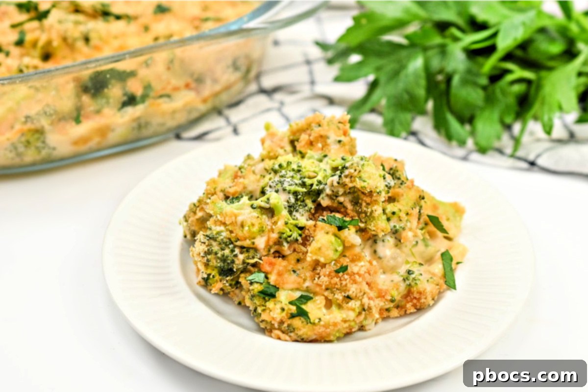 Broccoli mac and cheese casserole baking in a square dish