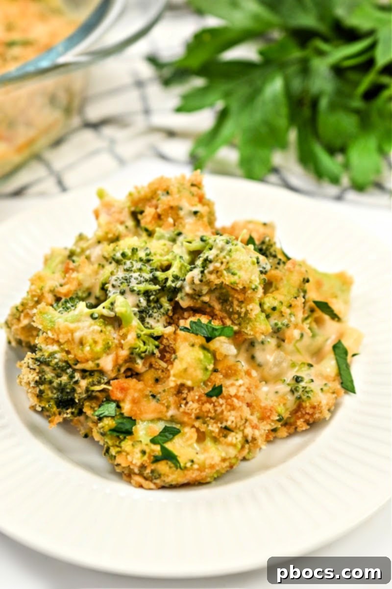 Portion of keto broccoli mac and cheese in a storage container