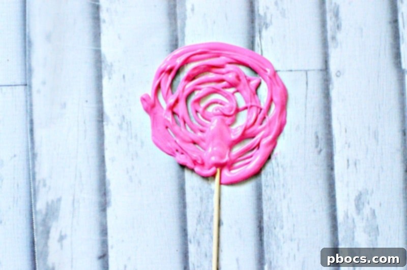 Chocolate Cone Preparation Filling and sealing the wax paper cone with melted chocolate