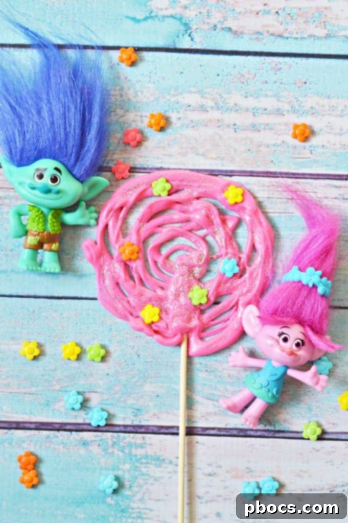 Finished Trolls Chocolate Pops Finished Trolls Chocolate Pops with glitter and flower candy