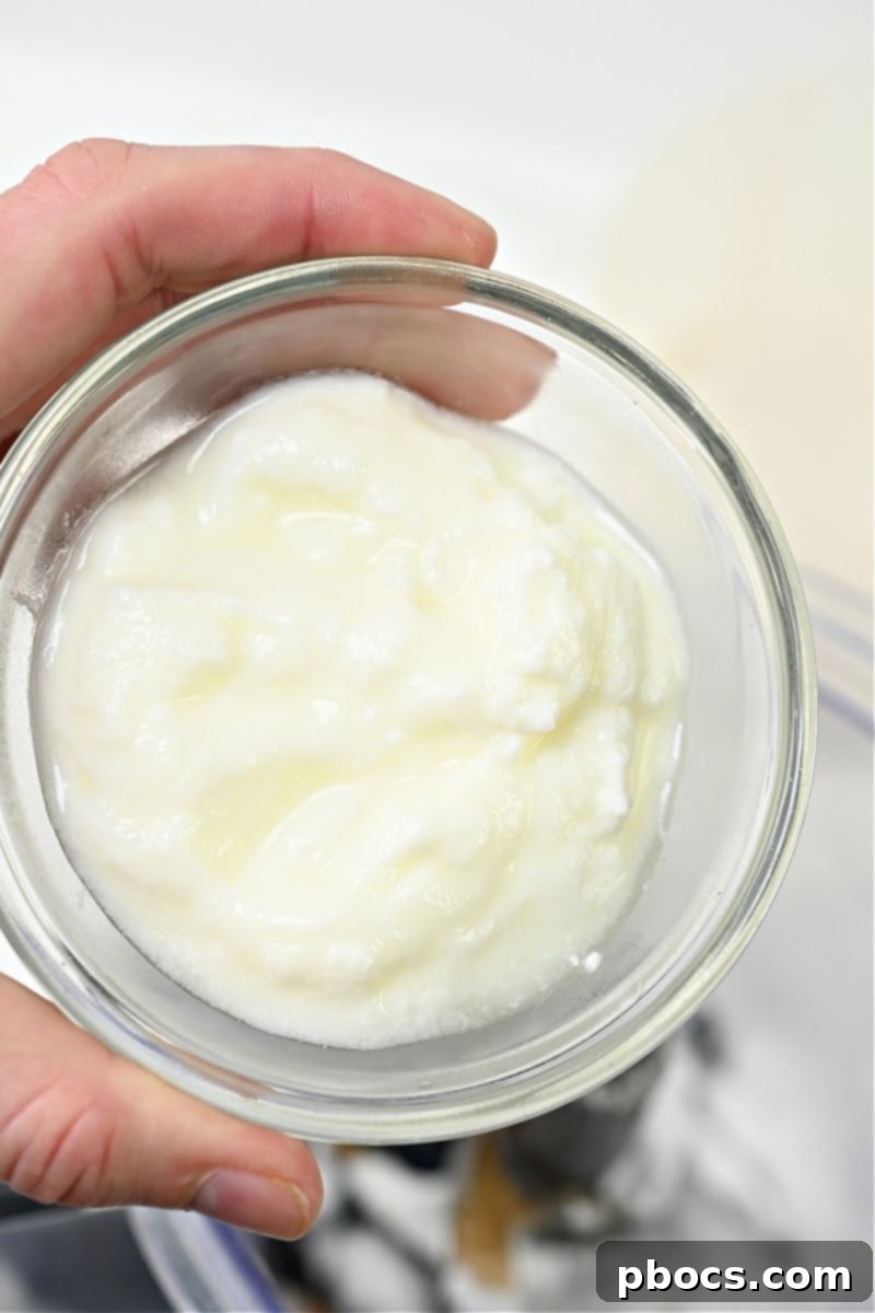 Adding Greek Yogurt to Blender for Smoothie