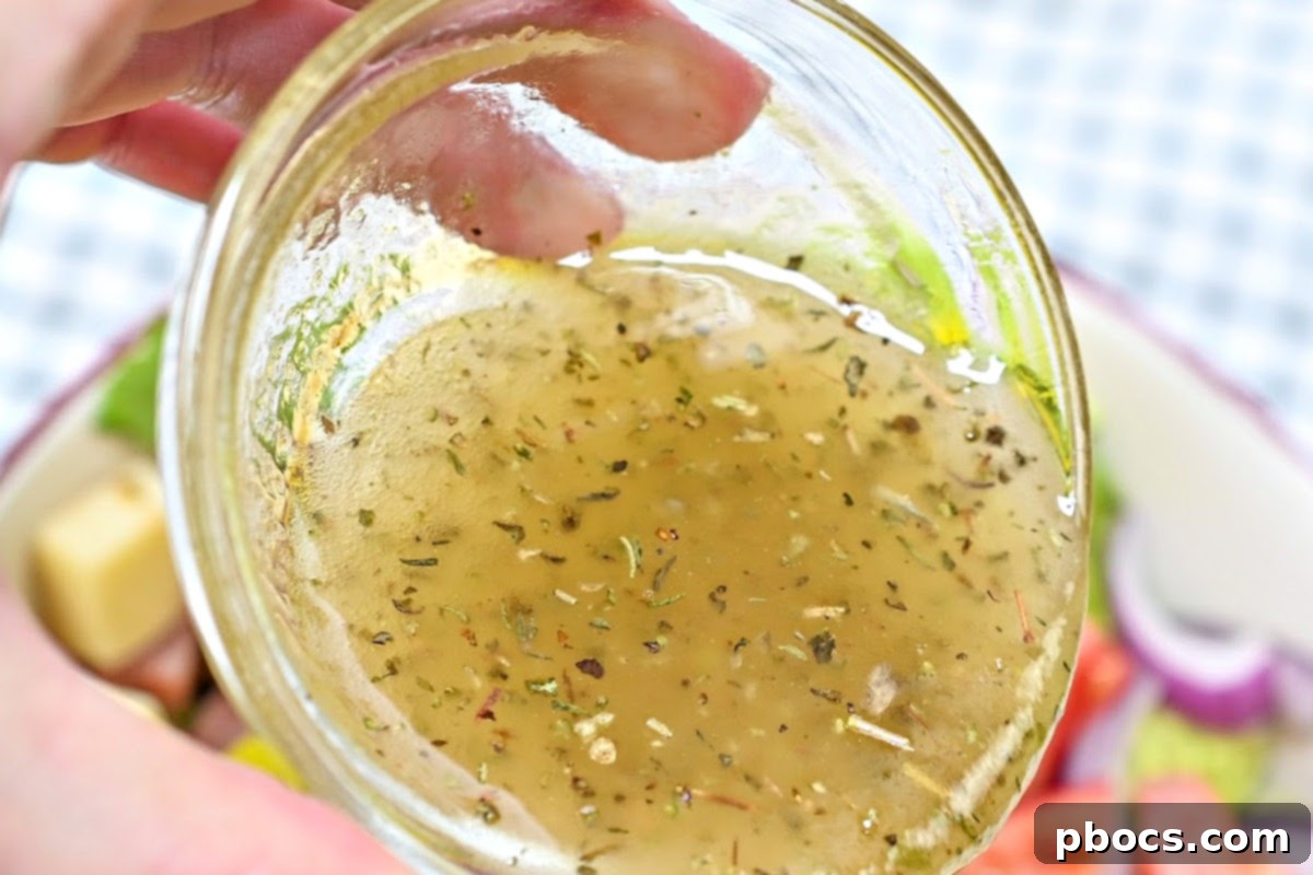 Adding the dressing to the salad