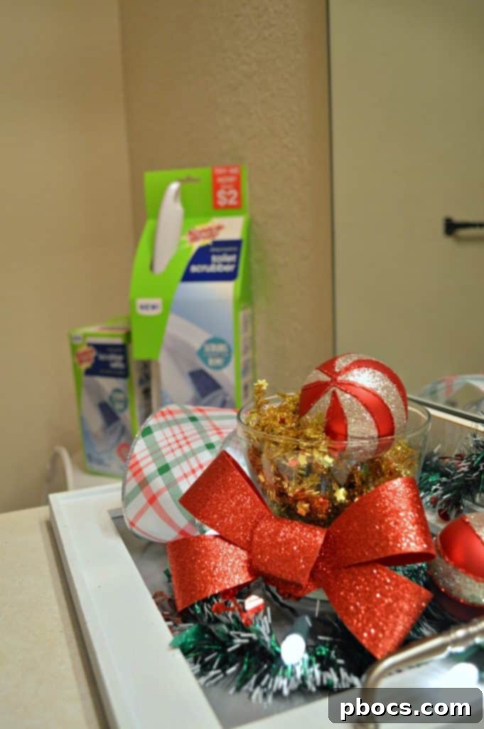 Detailed view of Christmas ornaments and ribbons hanging on a shower curtain