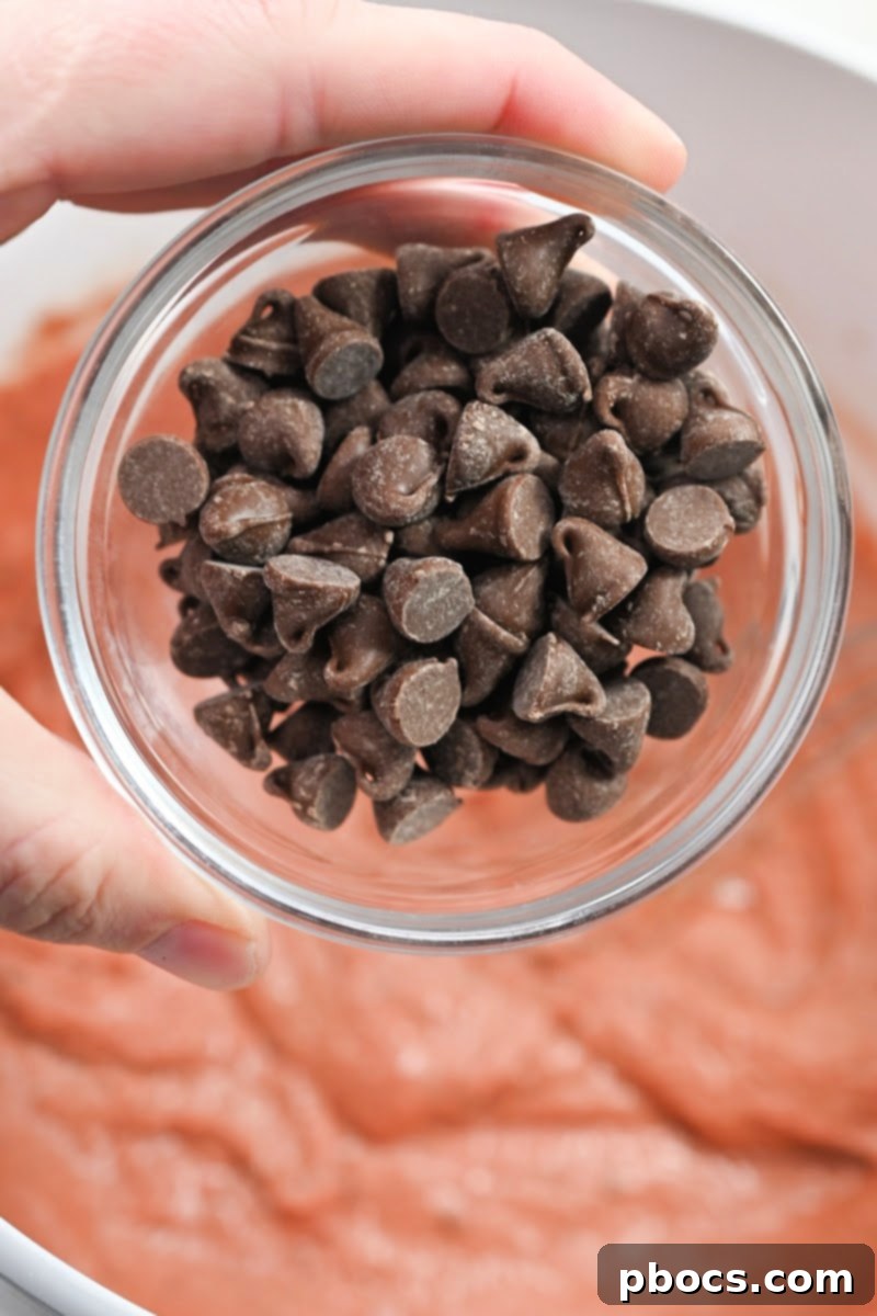 Adding keto chocolate chips to waffle batter