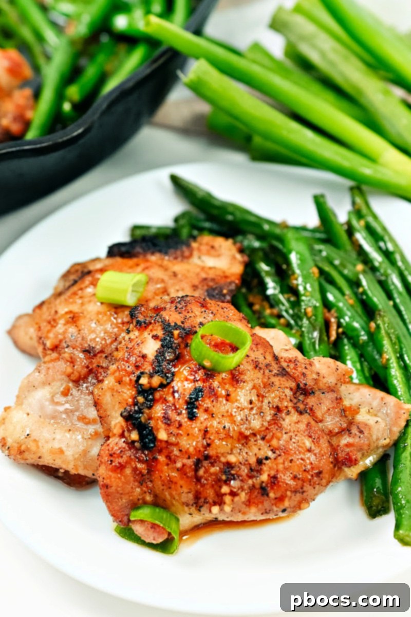 Keto Honey Garlic Chicken with Green Beans 5 A close-up view of the Keto Honey Garlic Chicken and Green Bean Skillet, showcasing the golden-brown chicken thighs.