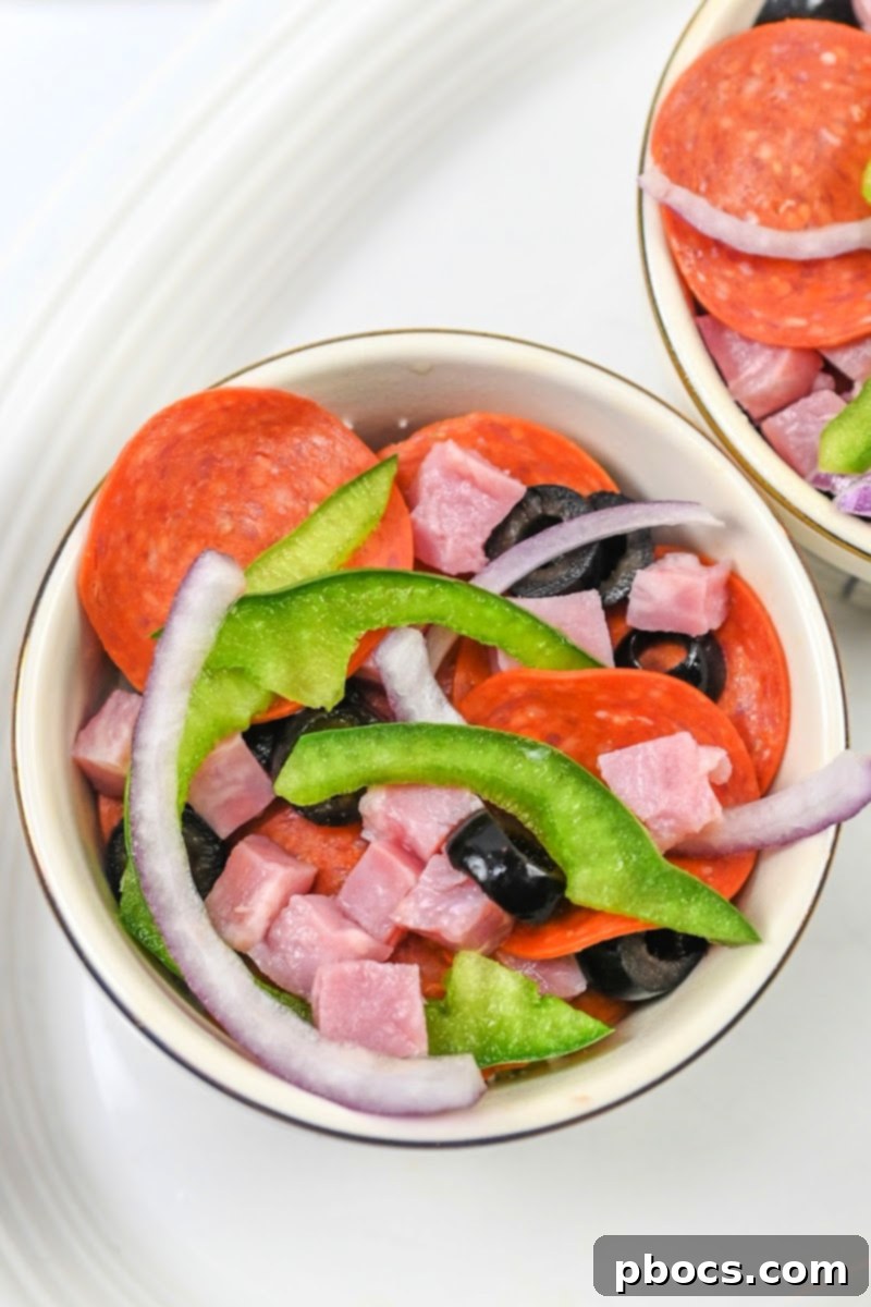 Adding peppers and onions