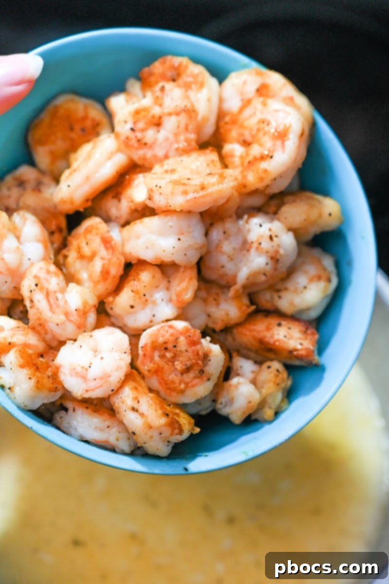 Cooked shrimp and chicken added back to the soup