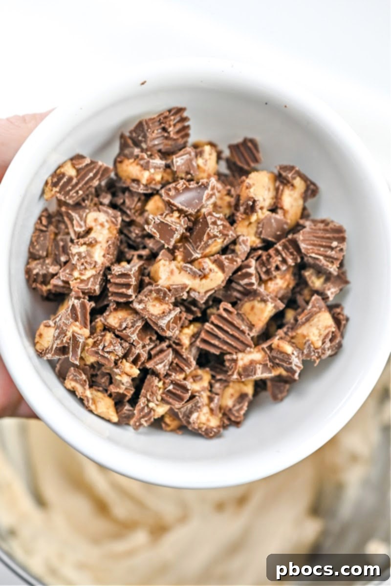 Keto Peanut Butter Chocolate Dip 11 Folding chopped sugar-free Reese's mini peanut butter cups into the creamy keto dip mixture