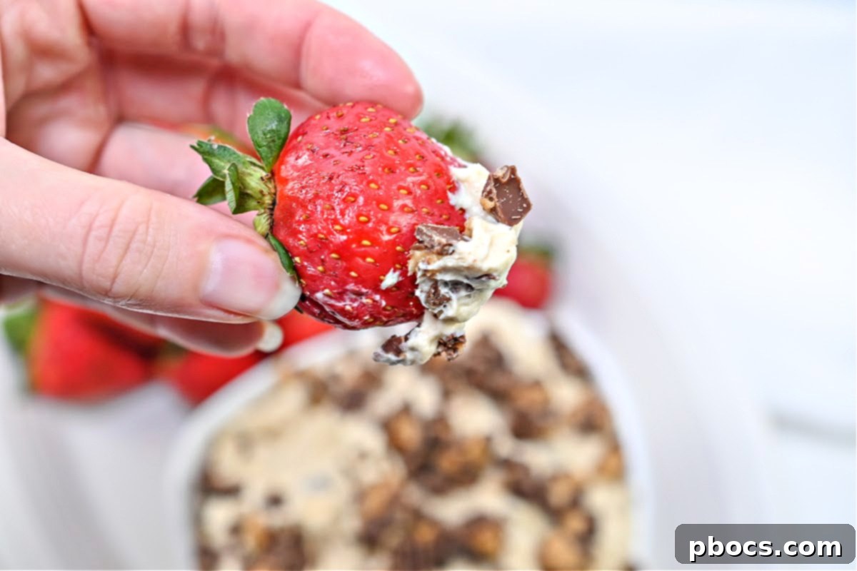 Keto Peanut Butter Chocolate Dip 12 Finished Keto Reese's Dip in a elegant serving bowl, garnished with the remaining sugar-free peanut butter cup pieces