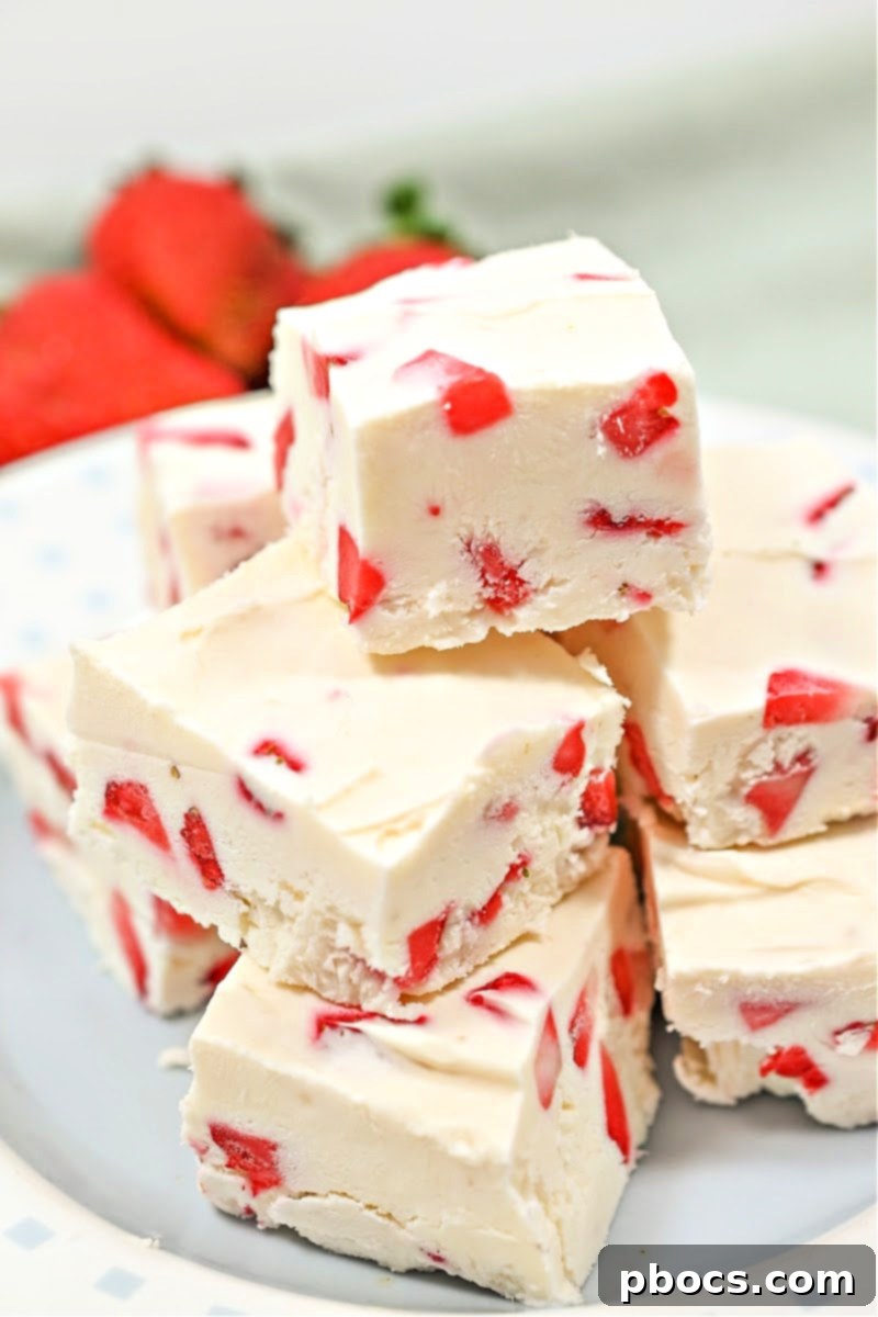 Decadent Keto Strawberry Fudge 2 Rich Keto Strawberry Cream Fudge squares, perfect for a low-carb treat