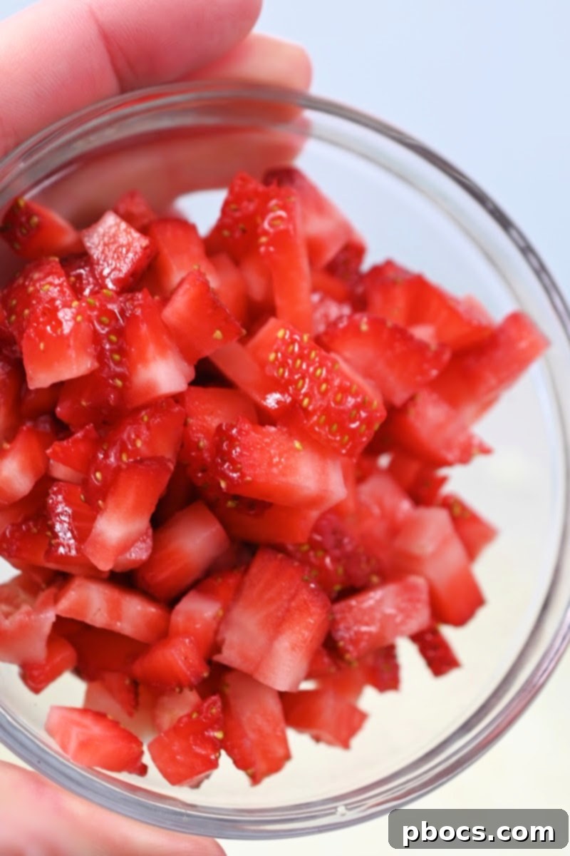 Decadent Keto Strawberry Fudge 11 Folding fresh chopped strawberries into the creamy fudge base