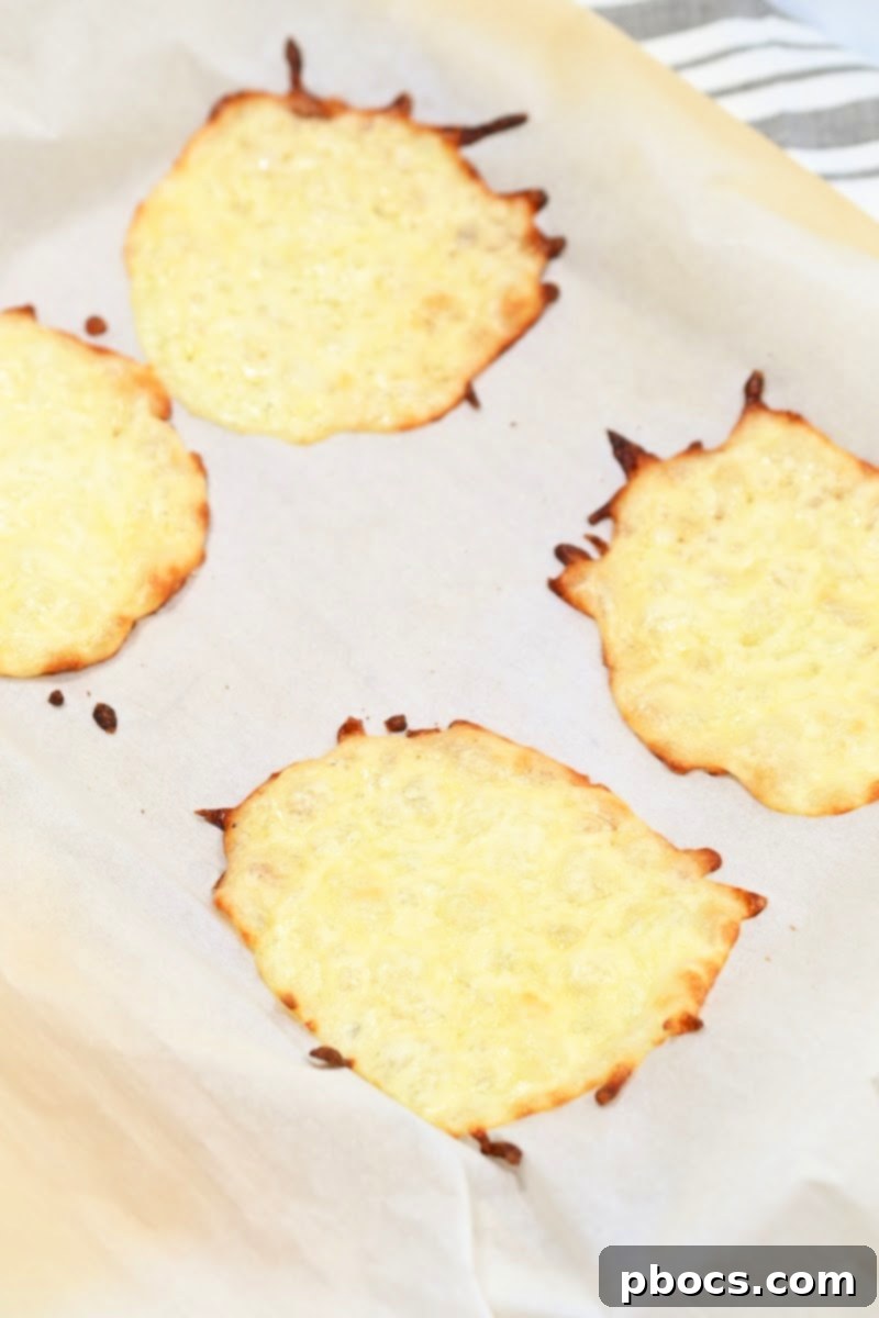 Keto Sausage Lasagna Pinwheels 13 Mozzarella cheese wraps baking in the oven