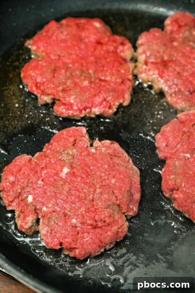 Grilling thin burger patties in a hot skillet