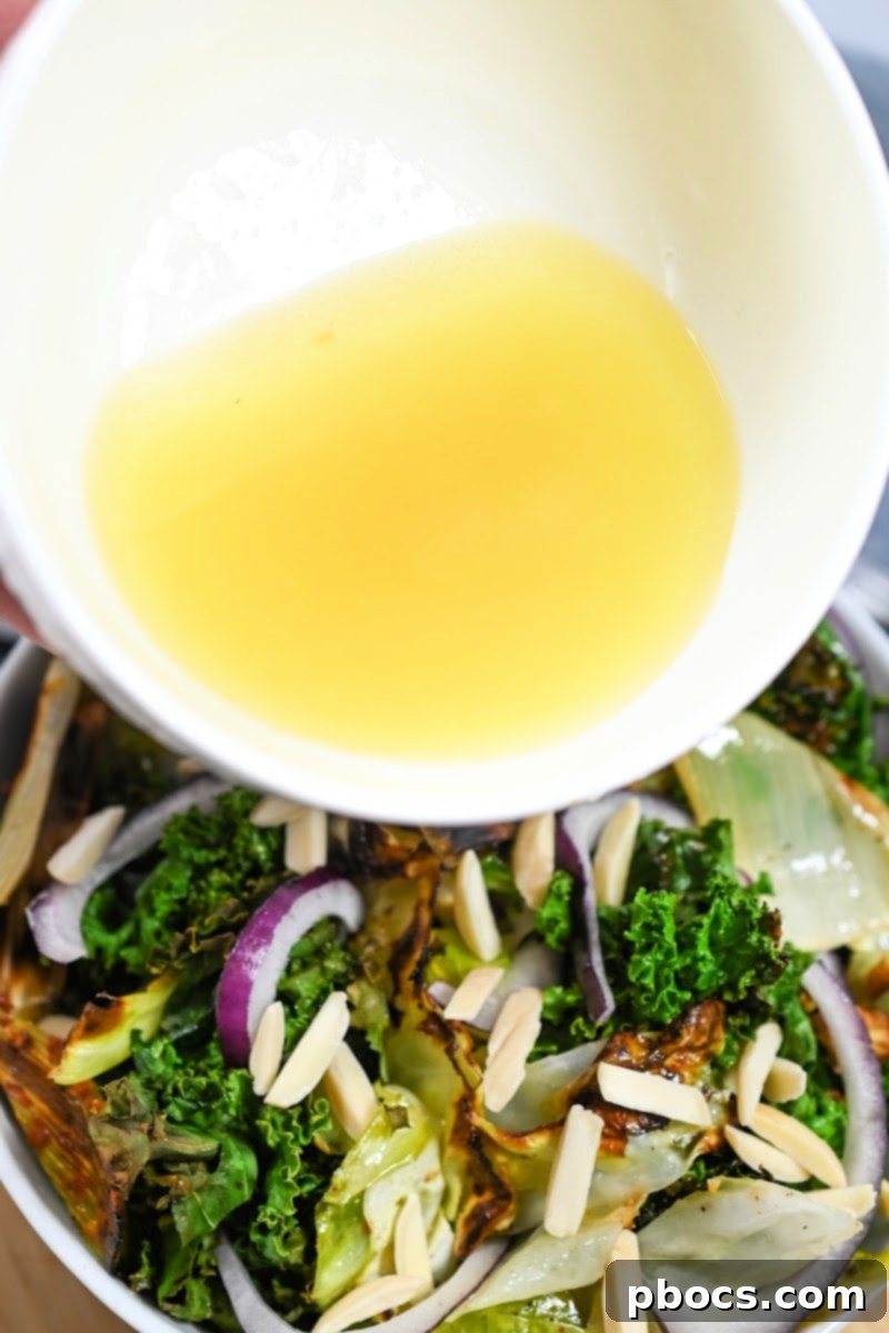 Adding honey lemon dressing to the baked salad