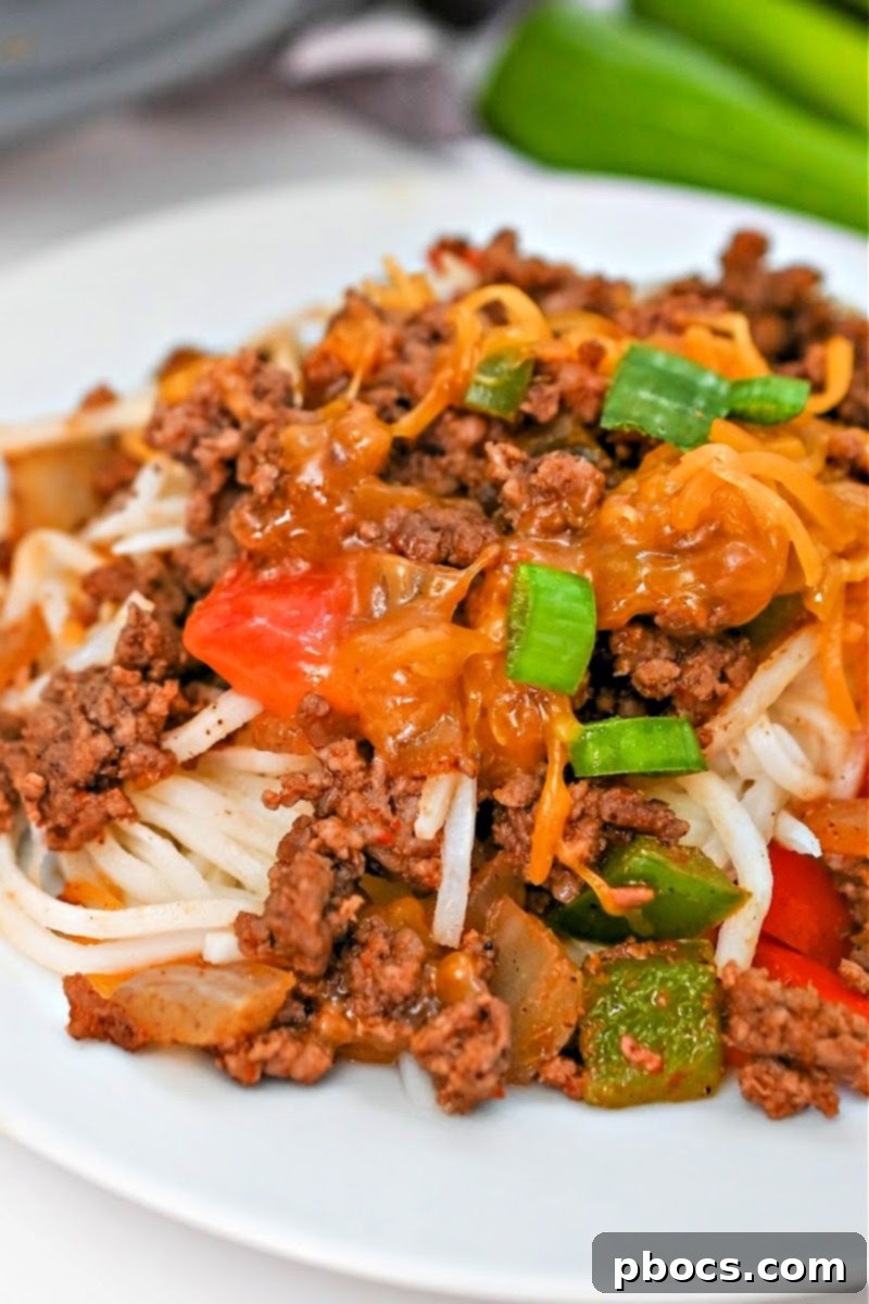 Close-up of Keto Taco Spaghetti with fresh toppings