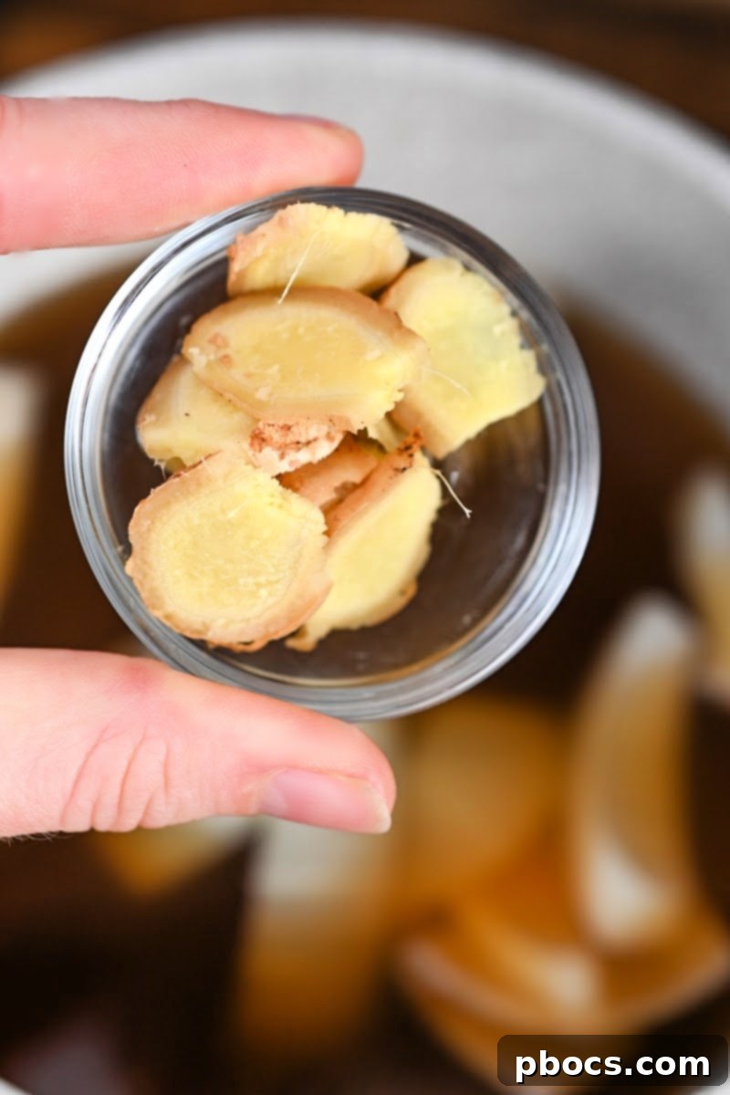 Sliced fresh ginger, a key aromatic for pho broth