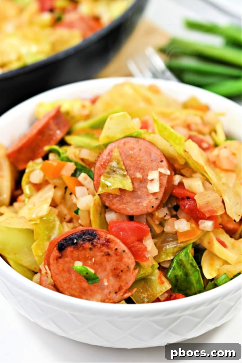 Keto Cabbage Jambalaya Skillet – A hearty, low-carb meal featuring spicy Andouille sausage, fresh cabbage, and diced tomatoes, all cooked in one skillet for an unforgettable keto dinner.