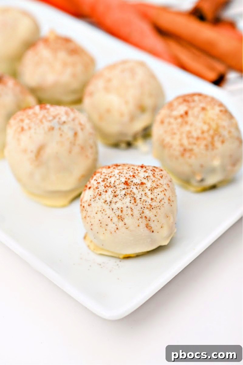 Finished Low-Carb White Chocolate Carrot Cake Balls with pecan garnish