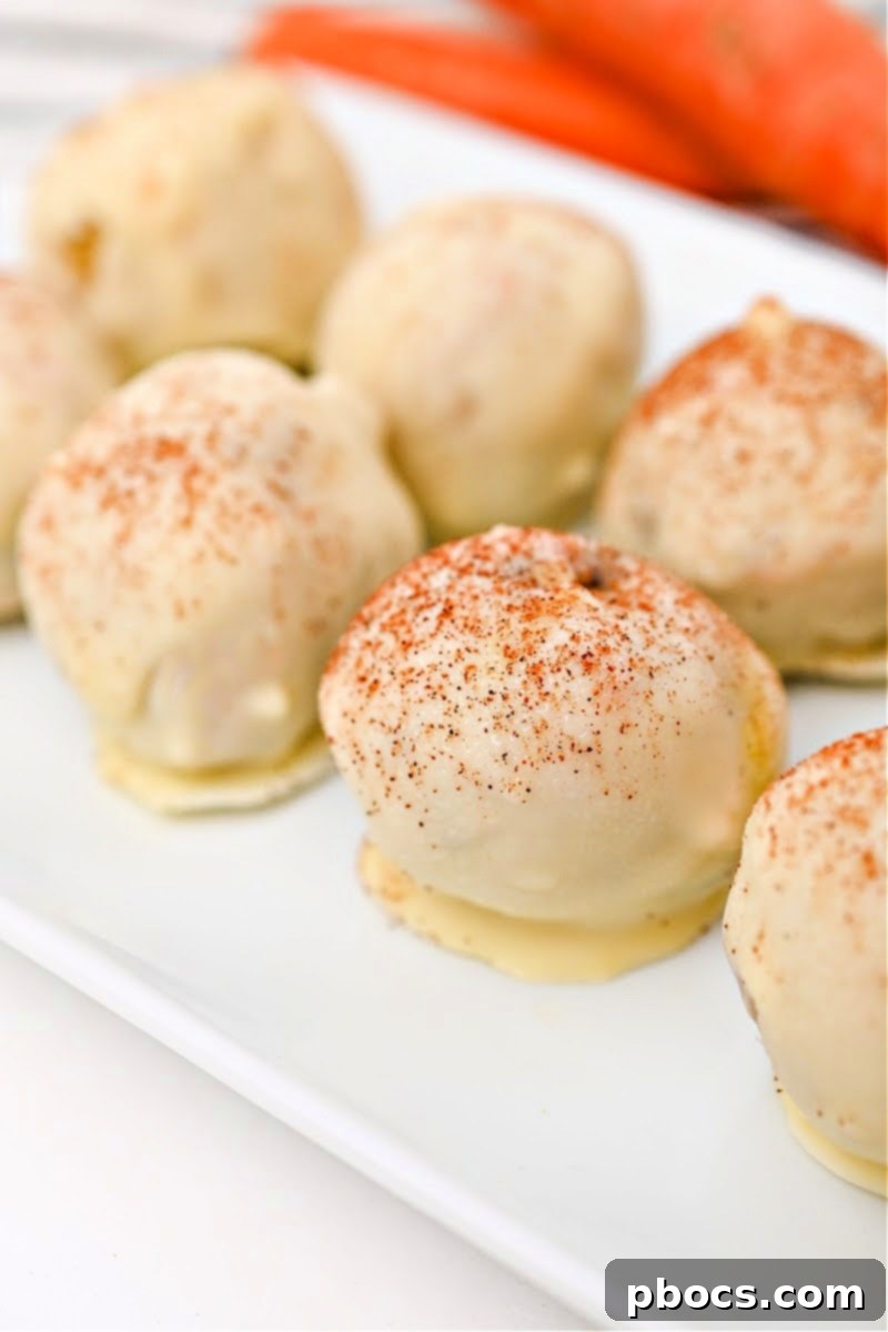 Two Low-Carb White Chocolate Carrot Cake Balls on a plate