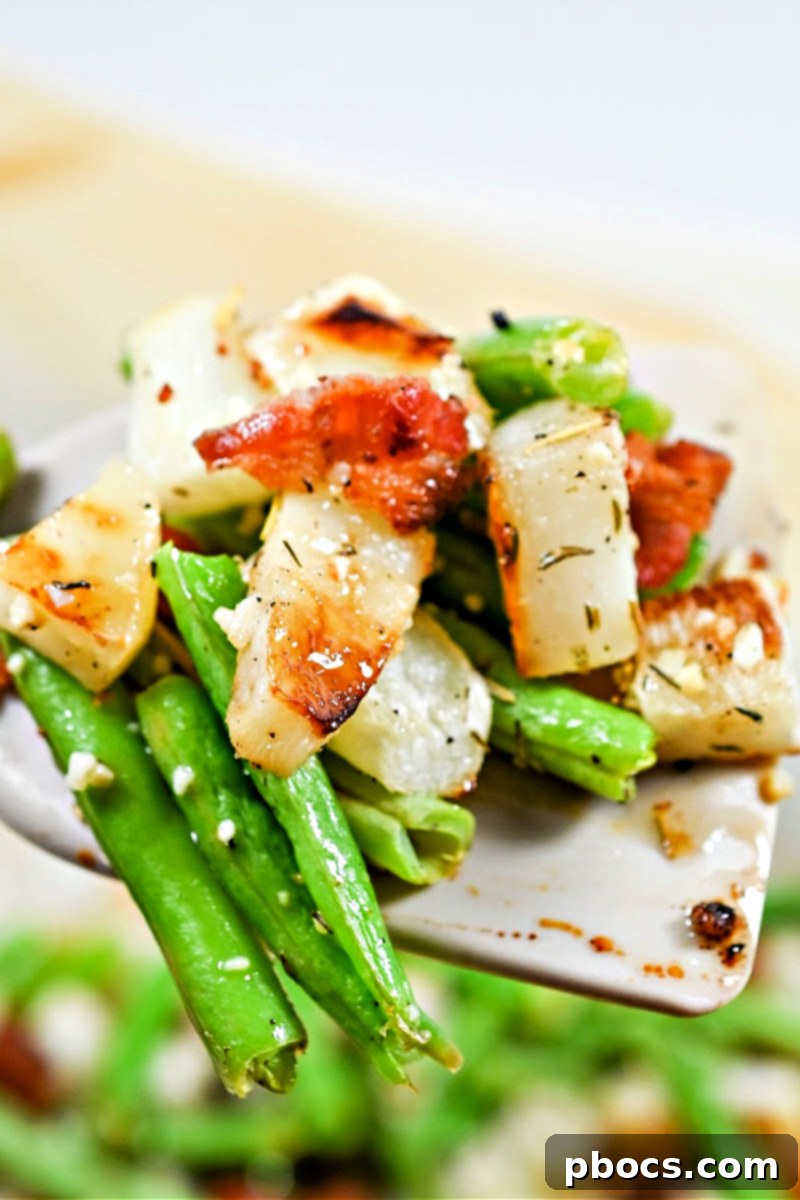 Crispy bacon crumbled over roasted green beans and turnips, adding savory flavor