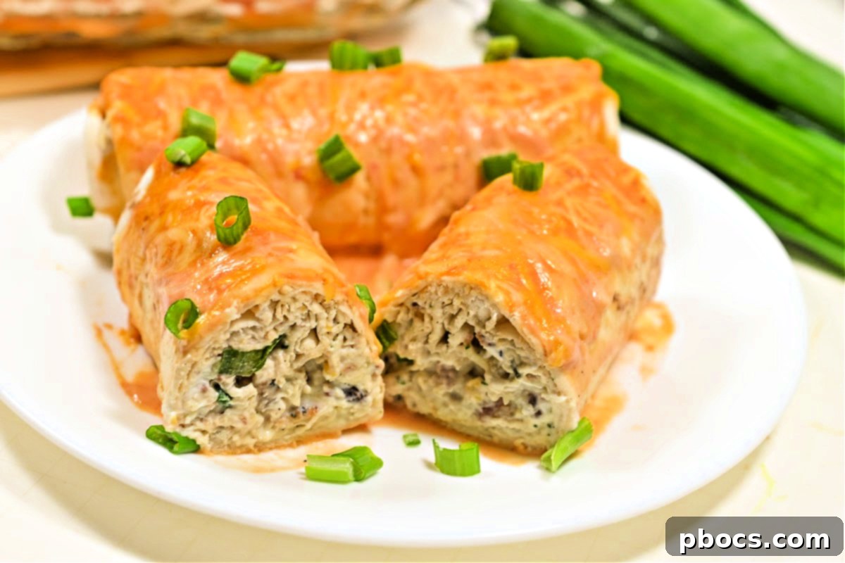 Keto Crack Chicken Enchiladas baking in a glass dish