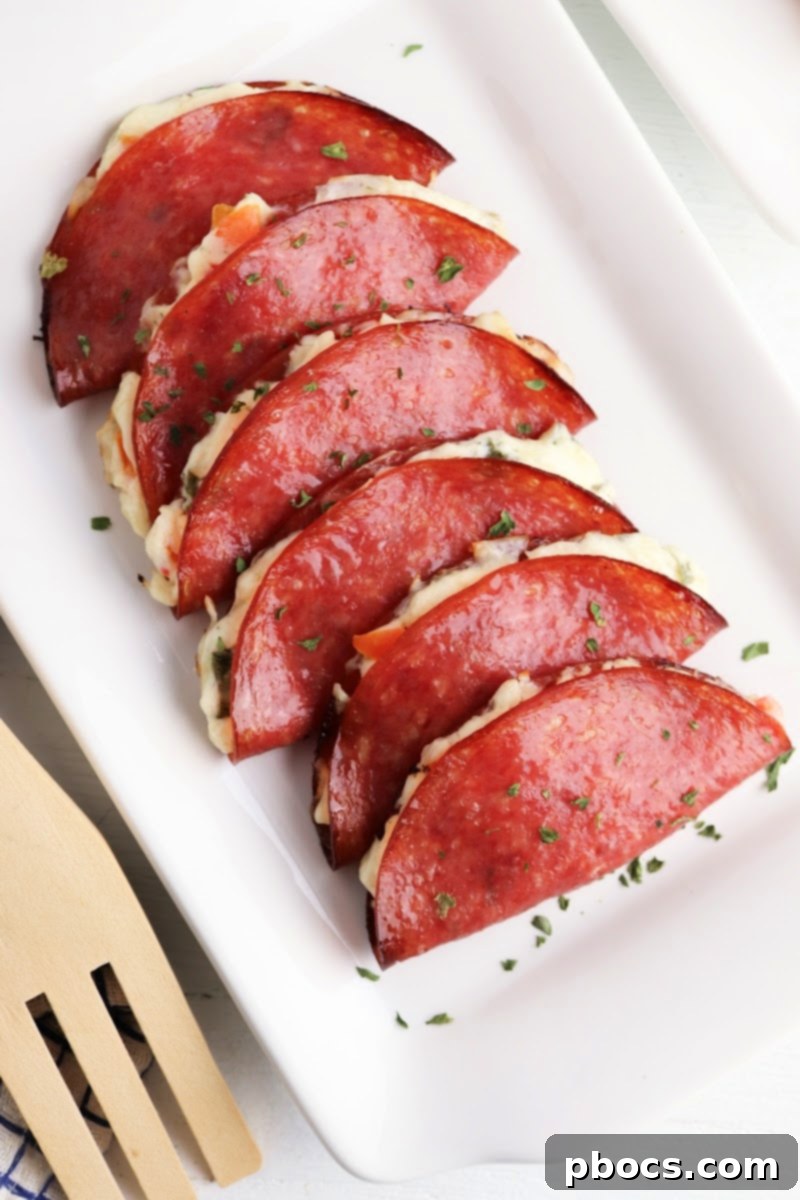 Deli salami slices being prepared for Keto Salami Tacos