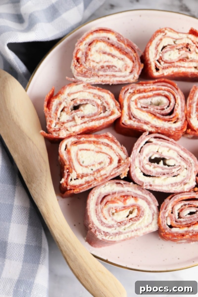 Keto Boursin Roll Ups: A delightful low-carb appetizer or lunch featuring creamy Boursin cheese rolled in savory cured meats like pepperoni and salami.