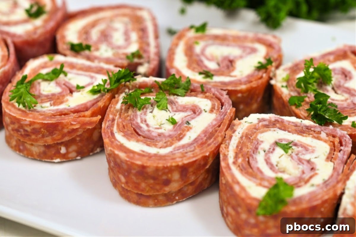 Final step of Keto Boursin Roll Ups: Slicing the chilled log into pinwheels for serving.