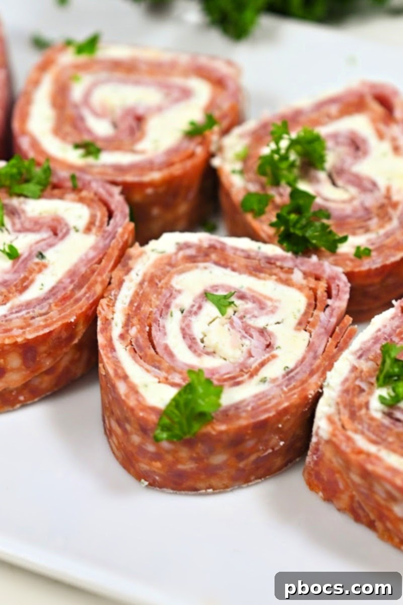 Closeup of Boursin cheese, highlighting its creamy texture and herb flecks, ready for use in Keto Boursin Roll Ups.