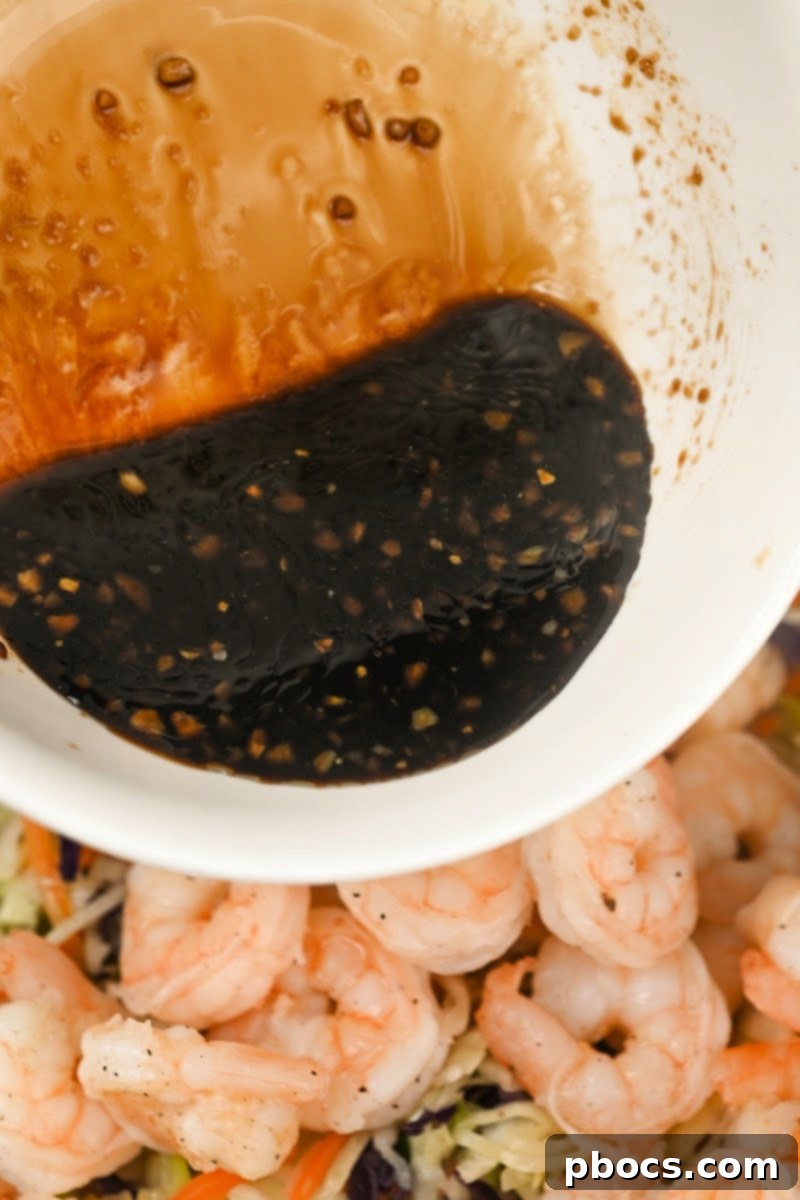 Deconstructed Keto Shrimp Egg Roll 11 Adding sauce to the egg roll filling