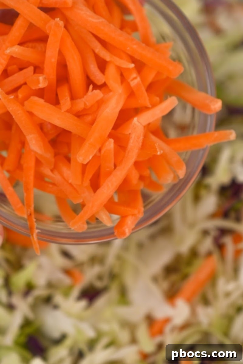Deconstructed Keto Shrimp Egg Roll 10 Adding carrots and other vegetables to the skillet