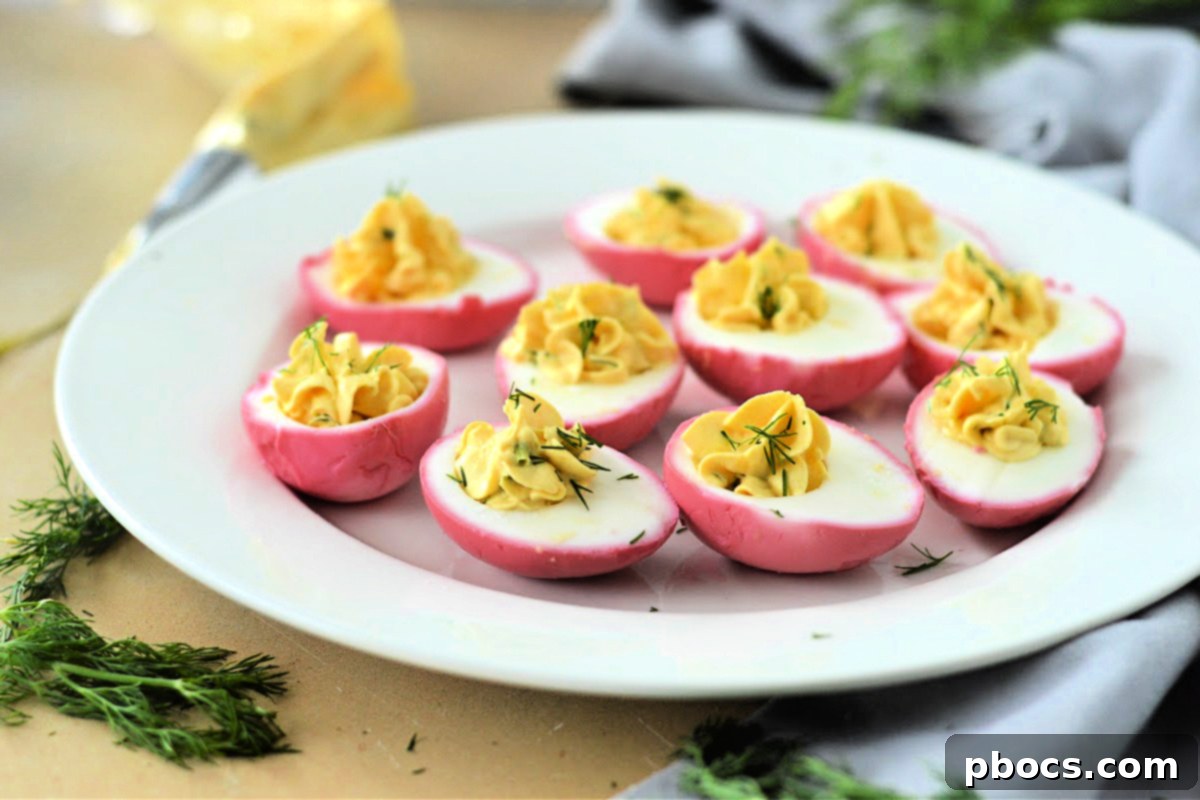 Close-up of Keto Pickled Deviled Eggs, showcasing their beautiful pink color and creamy filling