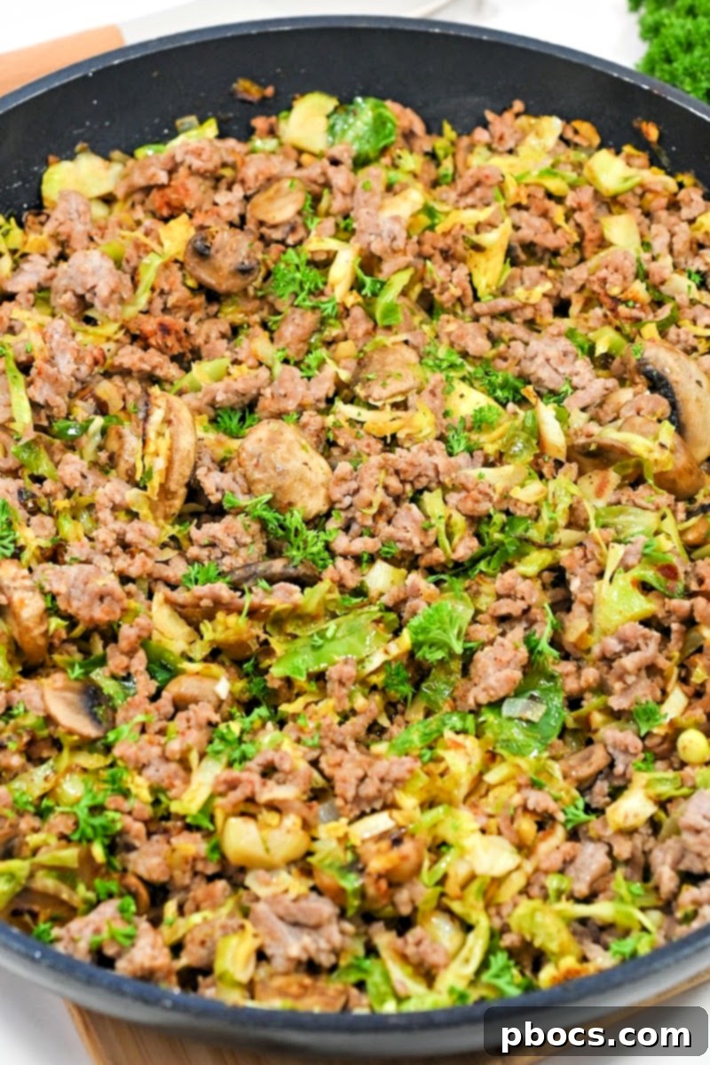 Keto Ground Pork and Shredded Brussels Sprouts Skillet mixed with spices