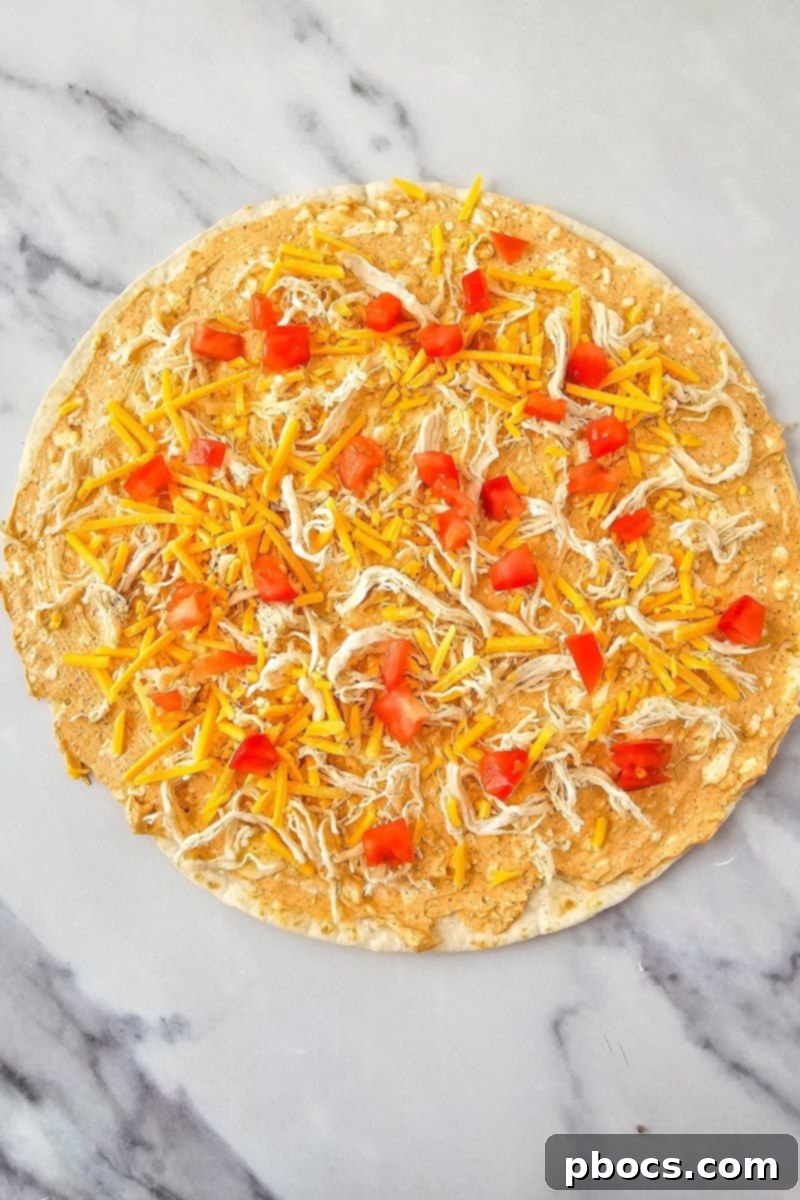 Adding toppings to the tortilla