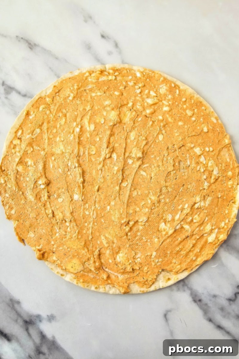 Adding cream cheese spread