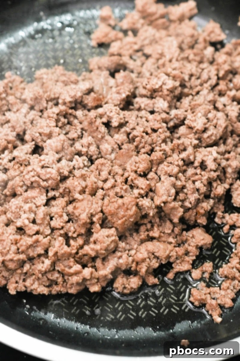 Keto Beef Pizza Bake 9 Browning ground beef in a skillet for casserole