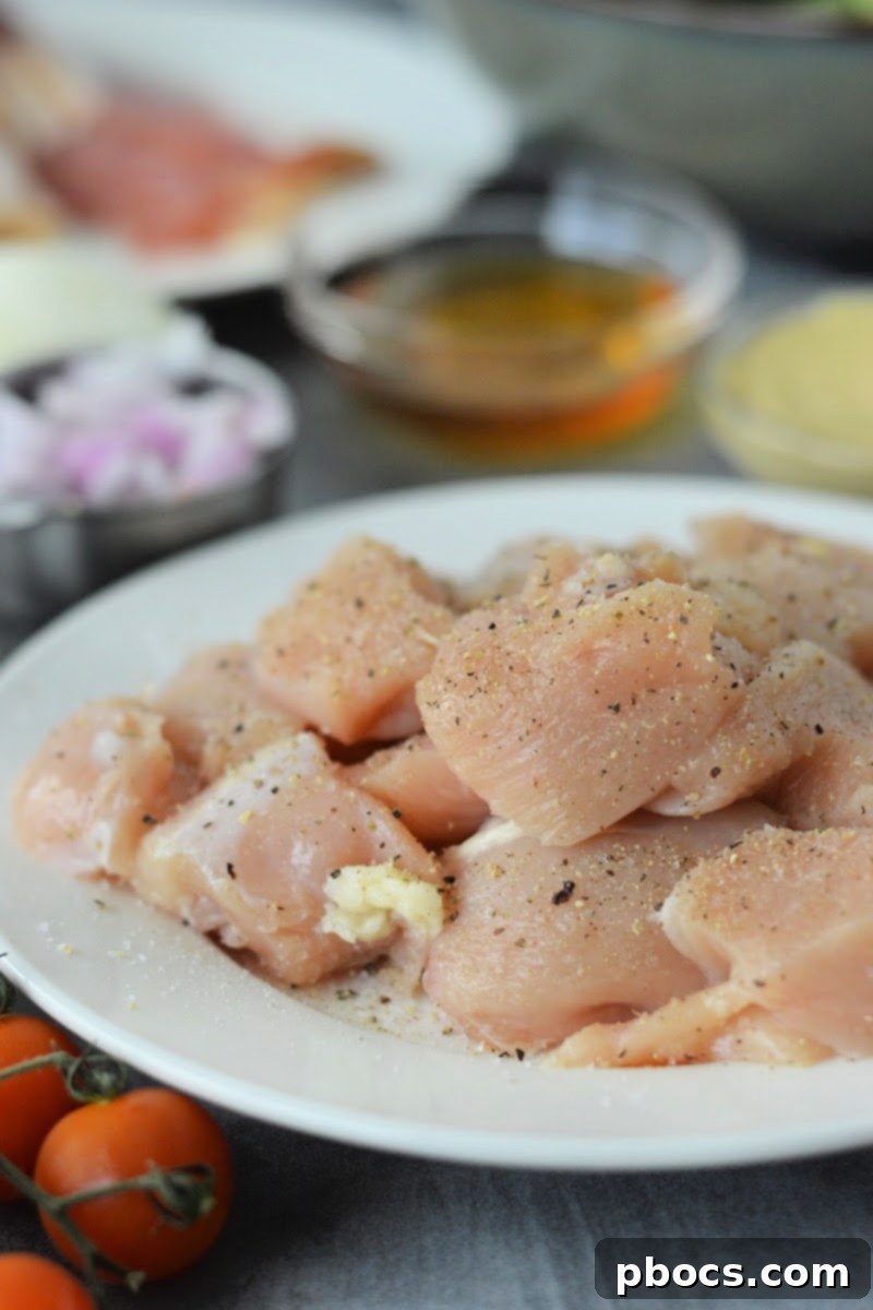 Savory Honey Mustard Chicken Salad Bites 9 Seasoning raw chicken breast pieces with salt and pepper