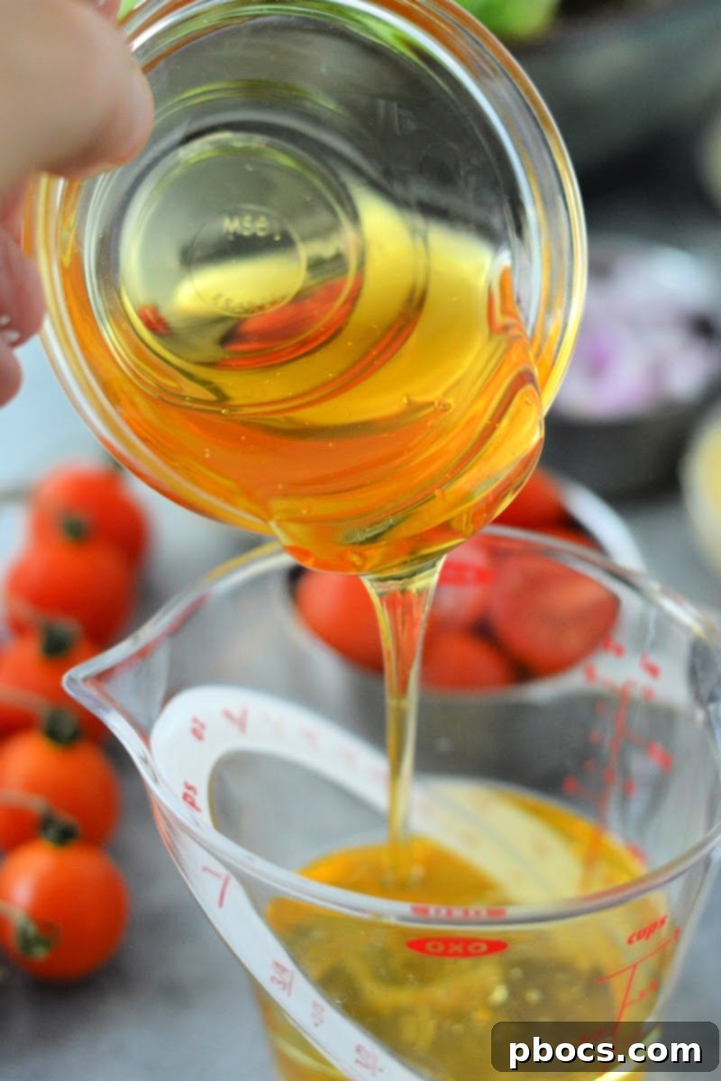 Savory Honey Mustard Chicken Salad Bites 10 Whisking ingredients for keto honey mustard dressing in a small bowl