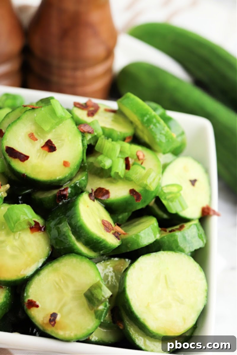 Vibrant Korean Cucumber Salad 3 Close-up view of freshly prepared Keto Korean Cucumber Salad, showing the vibrant green cucumbers and red dressing