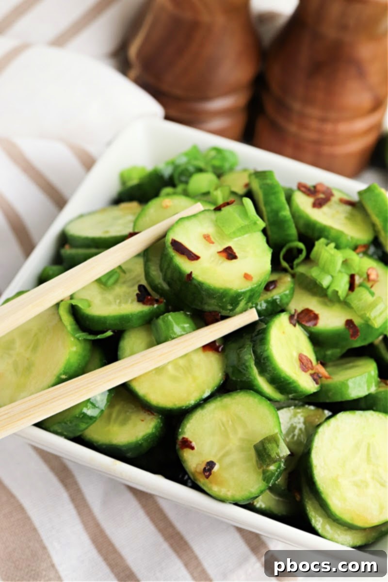 Vibrant Korean Cucumber Salad 7 Keto Korean Cucumber Salad being transferred into a glass mason jar for storage