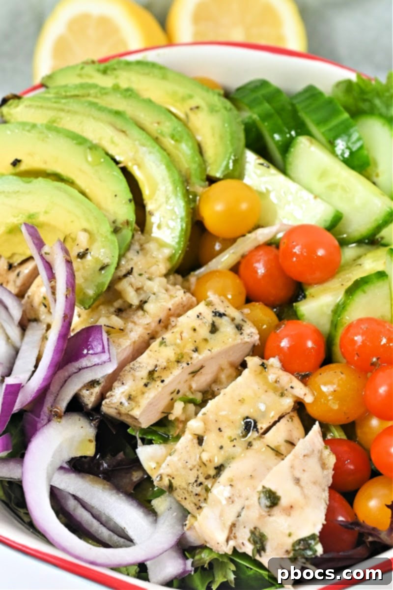 Mason Jar Salad for Meal Prep - Layered Keto Lemon Herb Chicken Salad in a jar.