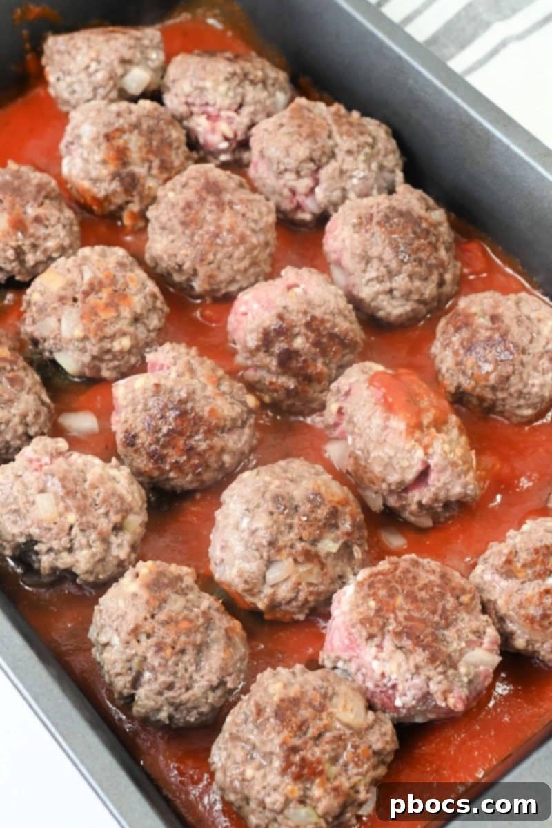 Placing Meatballs in the baking sheet
