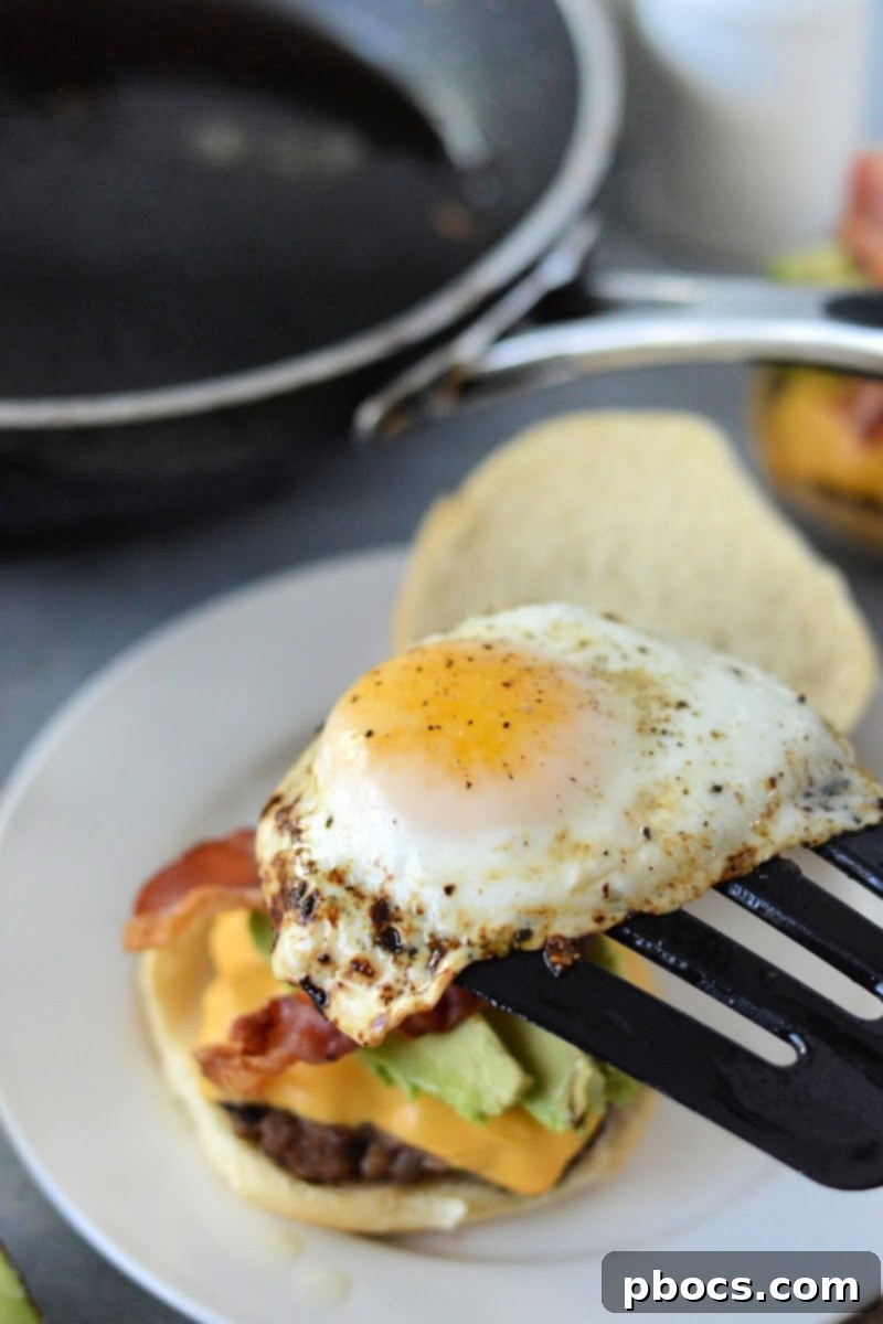 Adding egg to the Keto Breakfast Burger