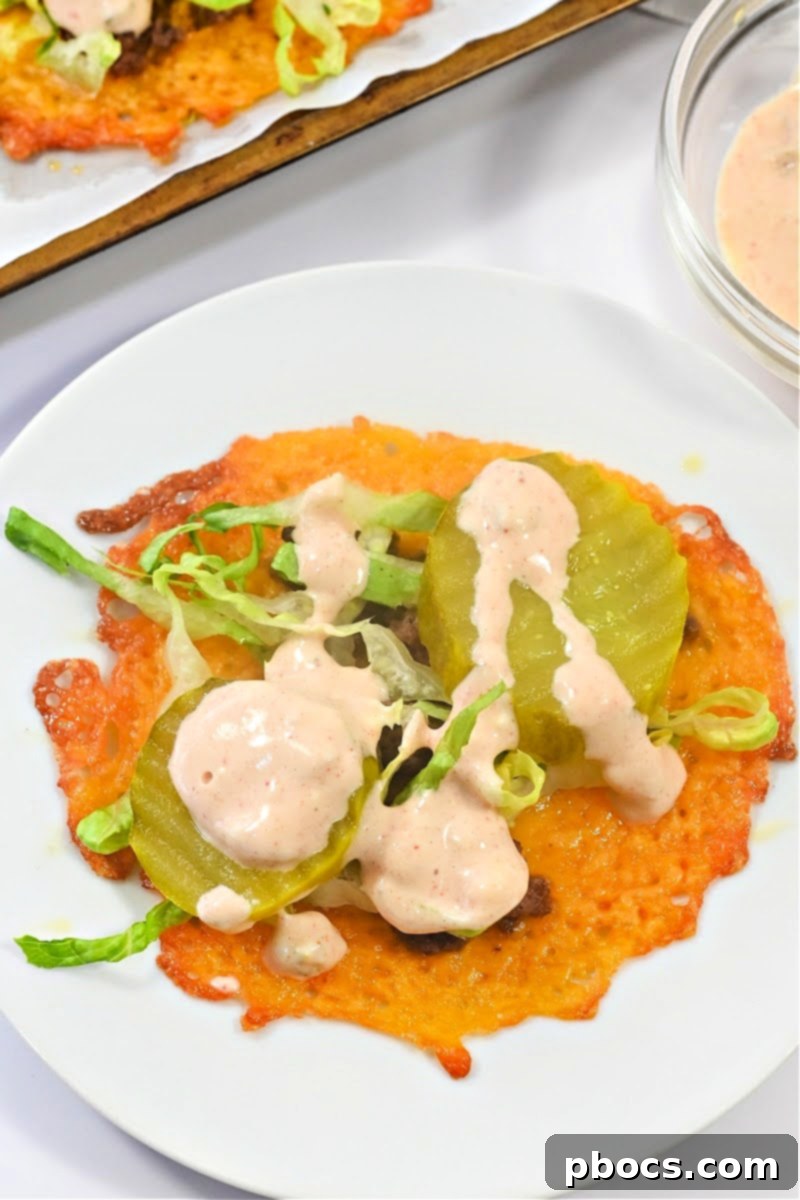 Big Mac Keto Cheese Crunchers 3 Close-up of golden brown Keto Big Mac Cheese Crisps topped with savory ingredients.