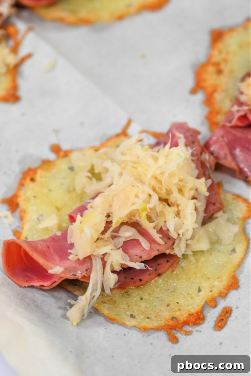Adding sauerkraut to the sliced corned beef on a cheese wrap