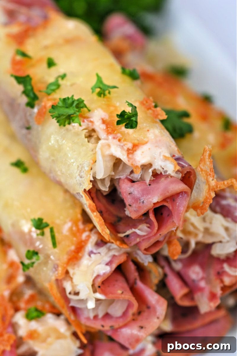 Two Crispy Keto Reuben Roll-Ups on a plate