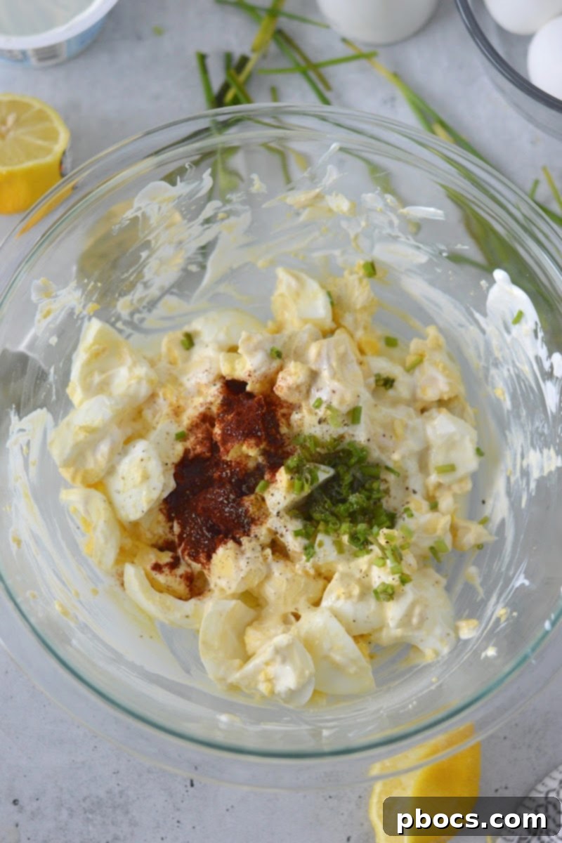 Mediterranean Greek Yogurt Egg Salad 11 Adding spices to the egg salad