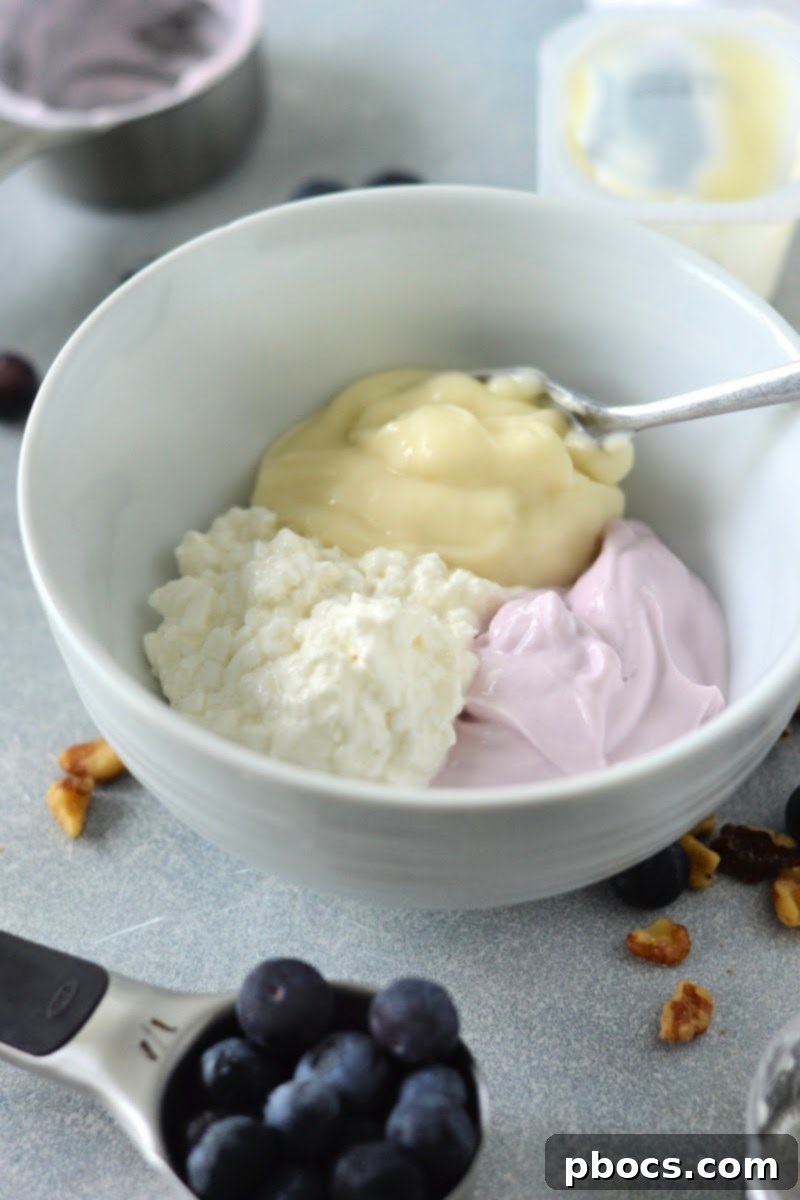 Mixing the sugar-free pudding, yogurt, and cottage cheese together for the parfait base